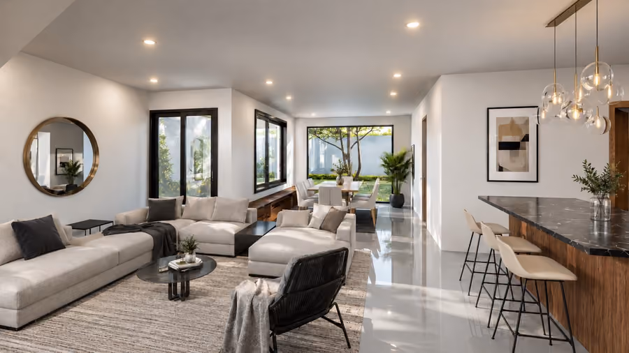 Render interior de la sala abierta con comedor, barra de cocina y vista al jardín